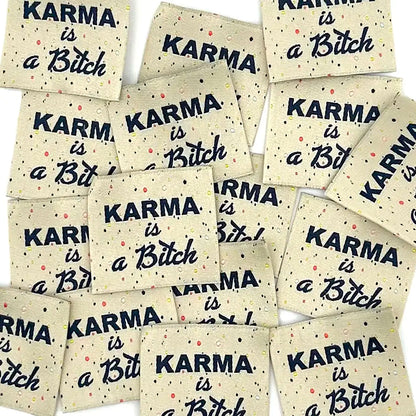 Etiquette à coudre de Home Couture, modèle Karma is a bitch (crème / multico - noir)