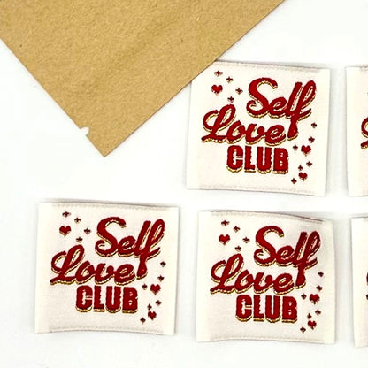 Etiquettes à coudre Home Couture, modèle Self Love Club (écru - rouge/lurex)