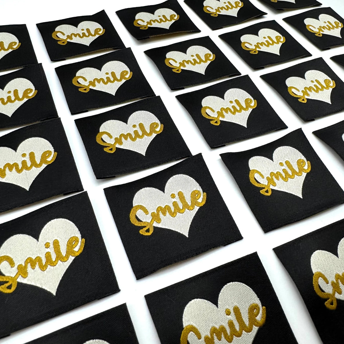 Etiquette à coudre de Home Couture, modèle Smile (noir / blanc - lurex)