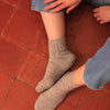 Patron de chaussettes au tricot Crazy Twist d'Elodie Morand paru dans le livre Woolship 2 de Lili Comme Tout